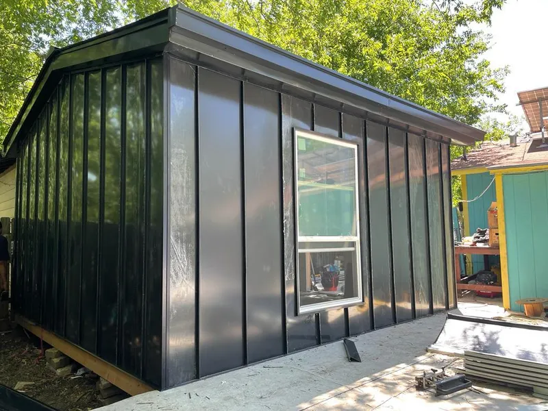 Black standing seam metal wall panels for Metal Roof Installation in Mandan